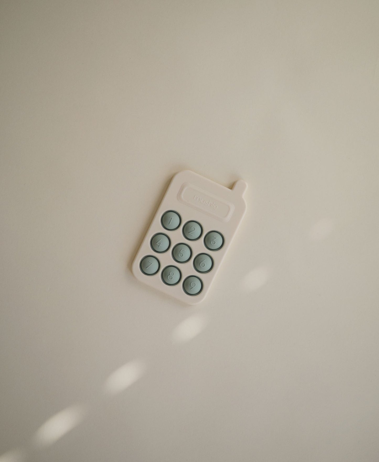 Mushie Pop It - Cellphone Cambridge Blue